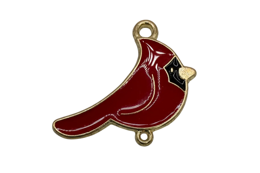 Glossy crimson cardinal bird with black face detail and gold trim