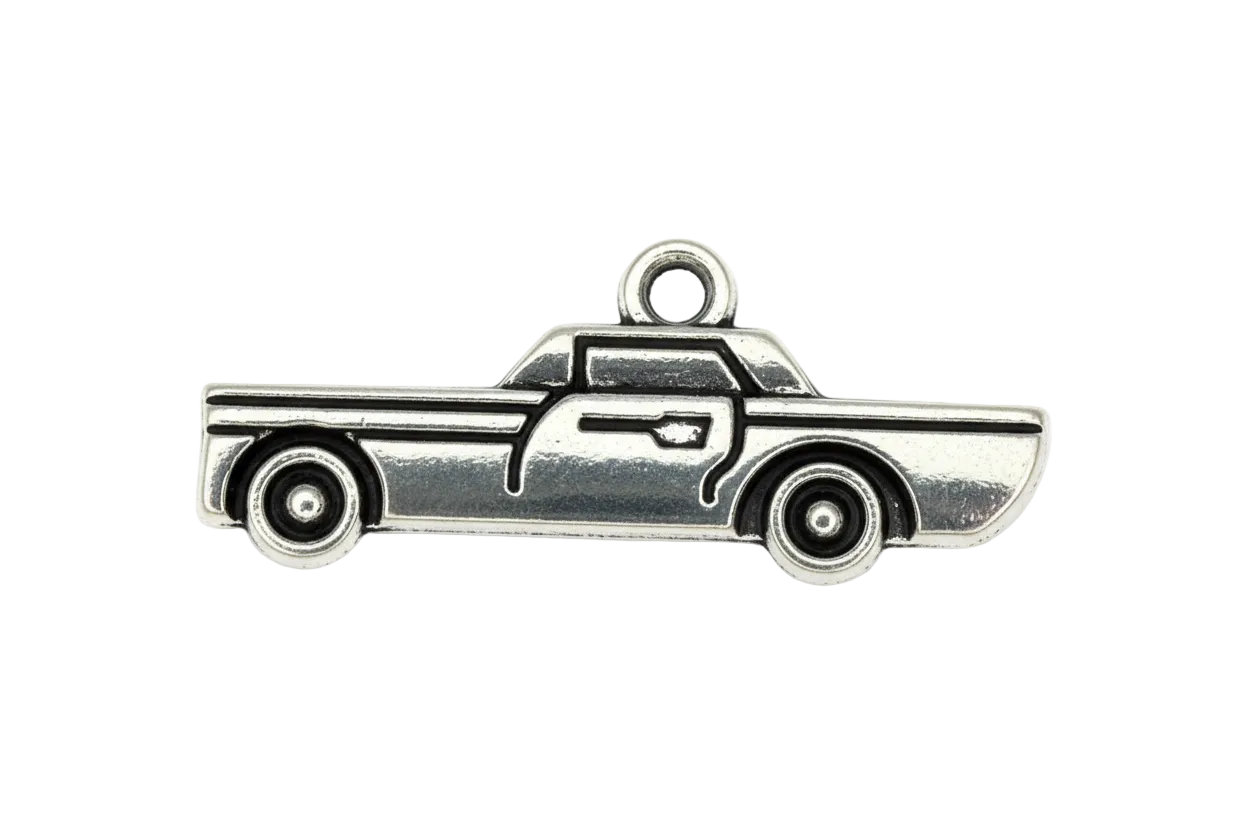 Silver-tone pickup truck silhouette charm with engraved line details on a black background
