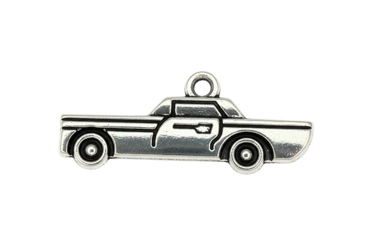 Silver-tone pickup truck silhouette charm with engraved line details on a black background