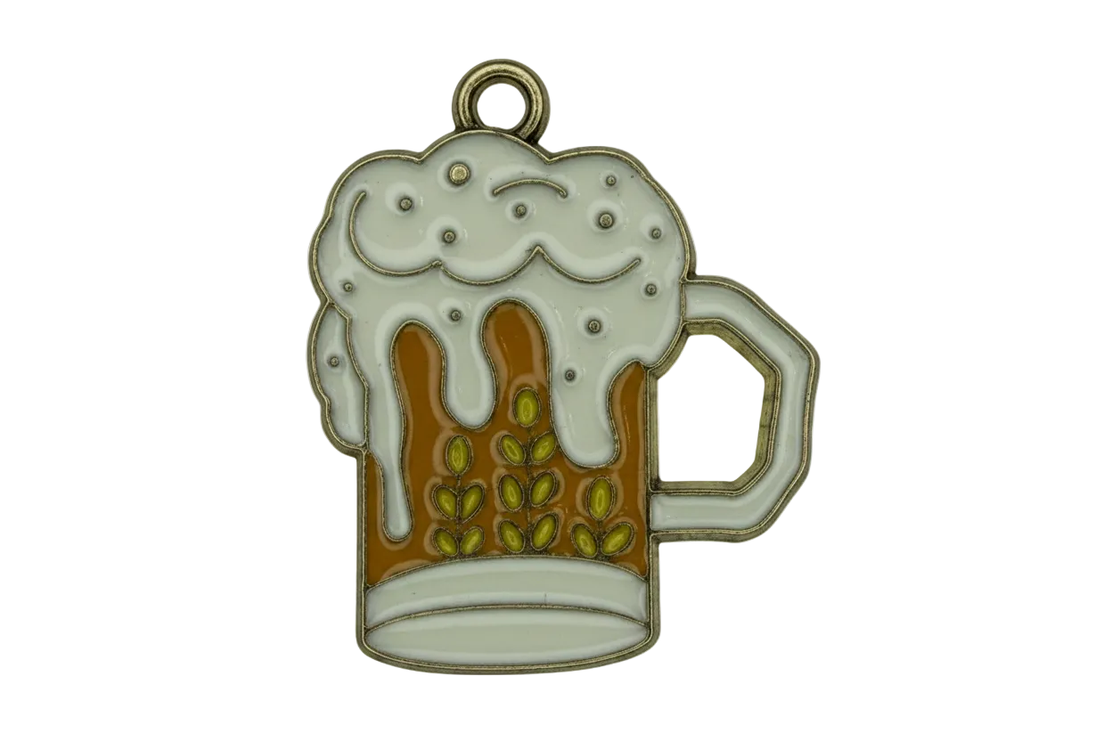 Gold-outlined enamel beer mug with white foam top and amber fill, olive details, and handle