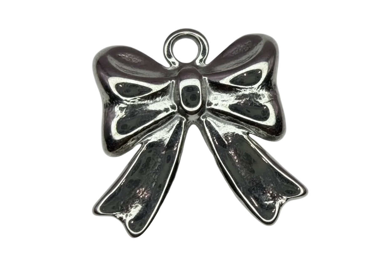 Polished silver ribbon bow charm with dark oxidized detailing