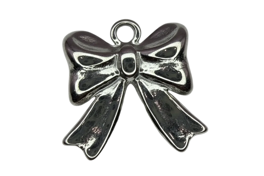 Polished silver ribbon bow charm with dark oxidized detailing