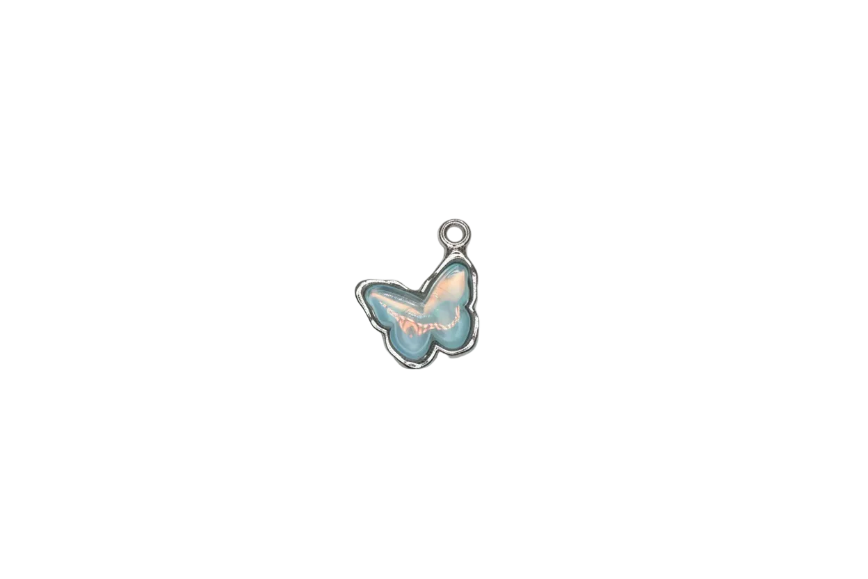 Opalescent blue butterfly cabochon in silver-tone frame