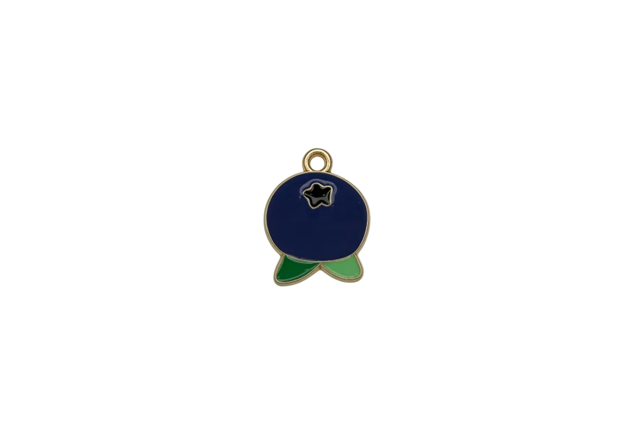 Navy enamel fish with black star and green fins, gold outline