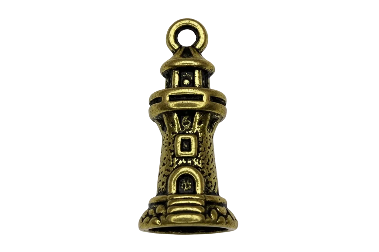 Antique gold lighthouse tower charm with blackened detailing