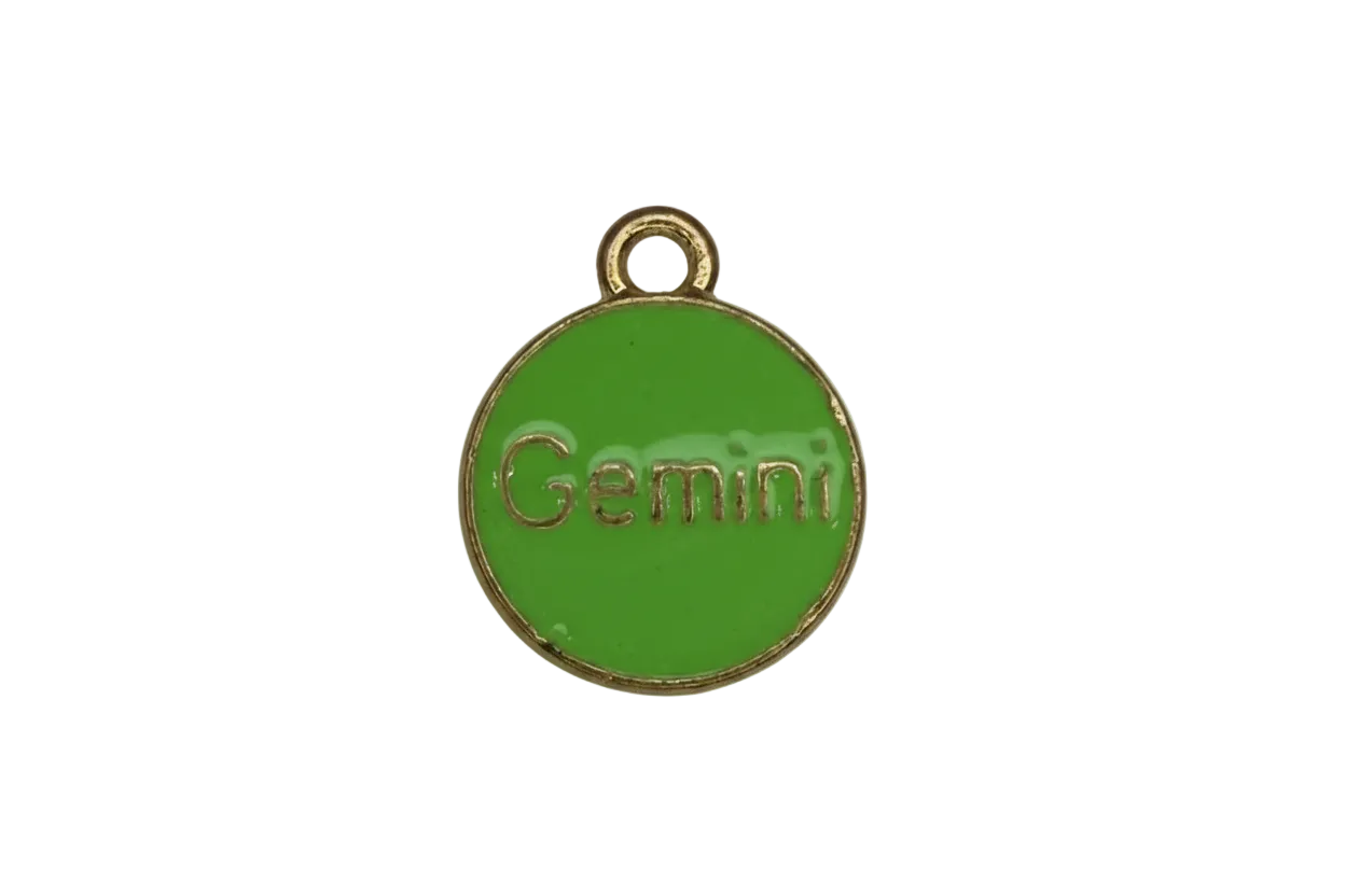Glossy green enamel round disc with gold rim and raised Gemini lettering