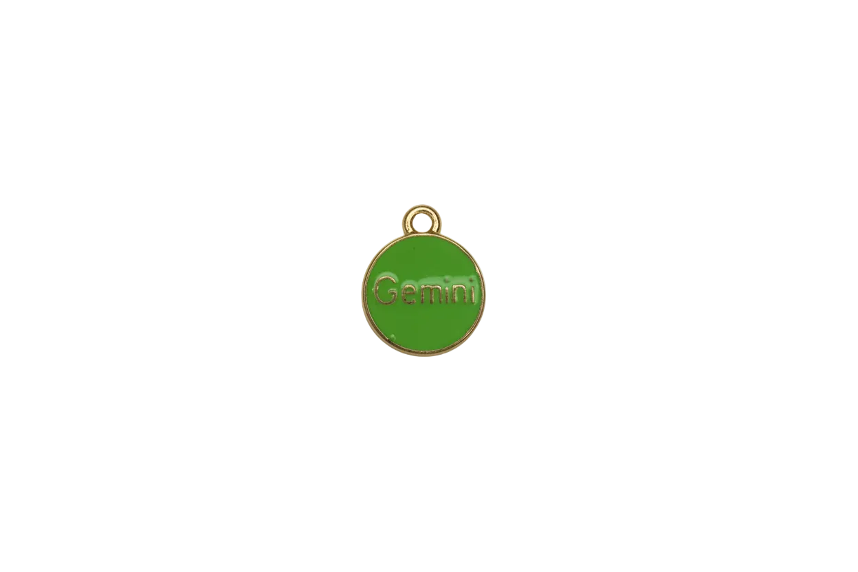 Green enamel disc with gold rim and Gemini lettering