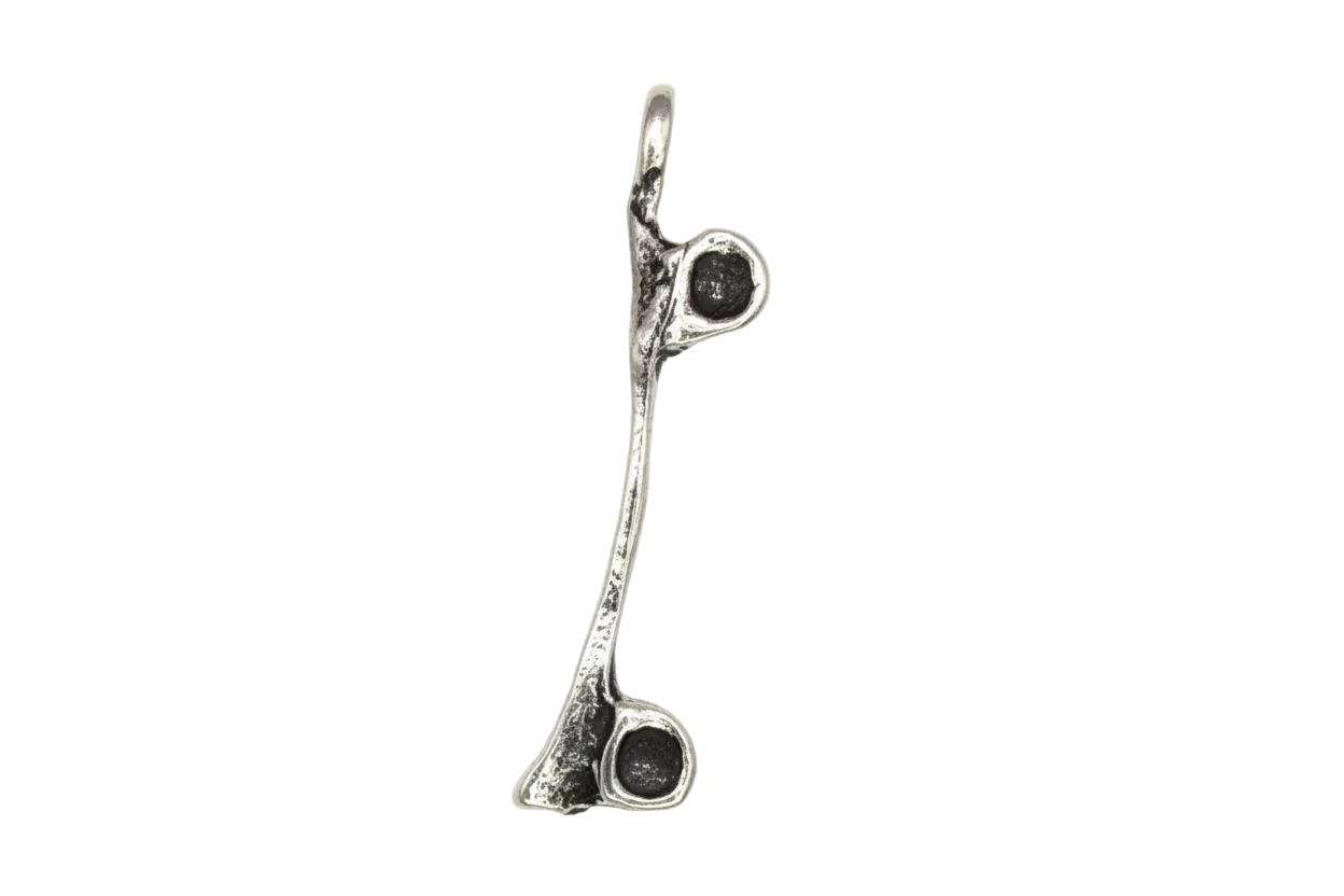 Antiqued silver lowercase i letter charm with oxidized details on black background