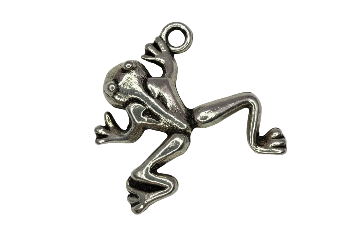 Polished silver-tone frog figure with sculpted legs and raised eyes