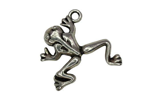 Polished silver-tone frog figure with sculpted legs and raised eyes