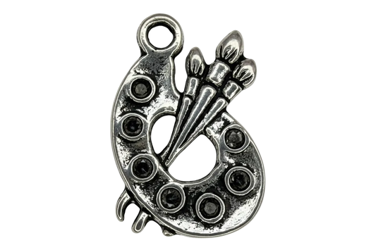 Antiqued silver artist palette charm with three paintbrush details and raised paint wells