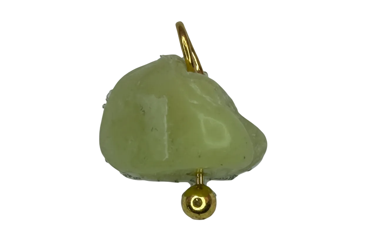 Pale lemon-lime nugget gemstone with gold finish accents on black background