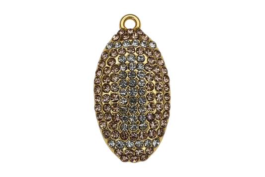 Gold oval pavé piece with champagne and clear crystals in a raised, textured pattern