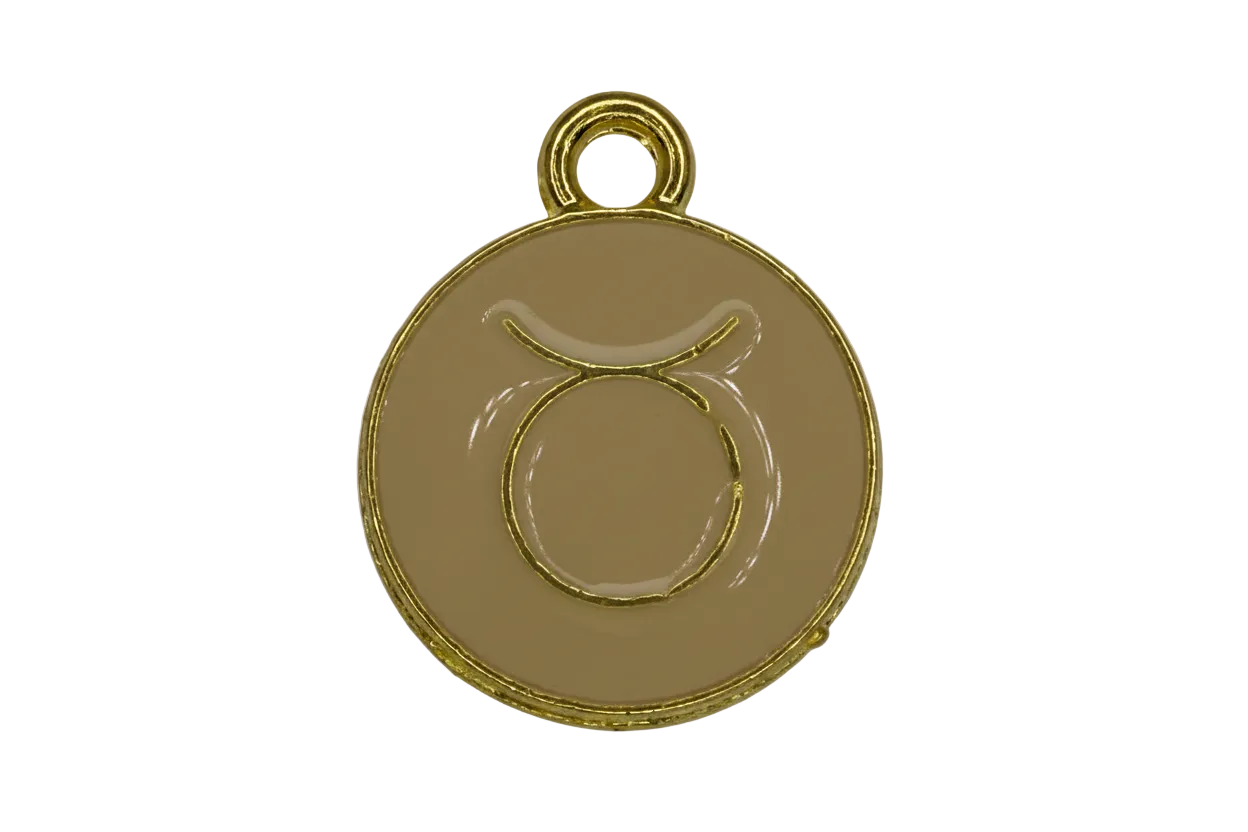 Round beige enamel Taurus zodiac medallion with raised gold symbol