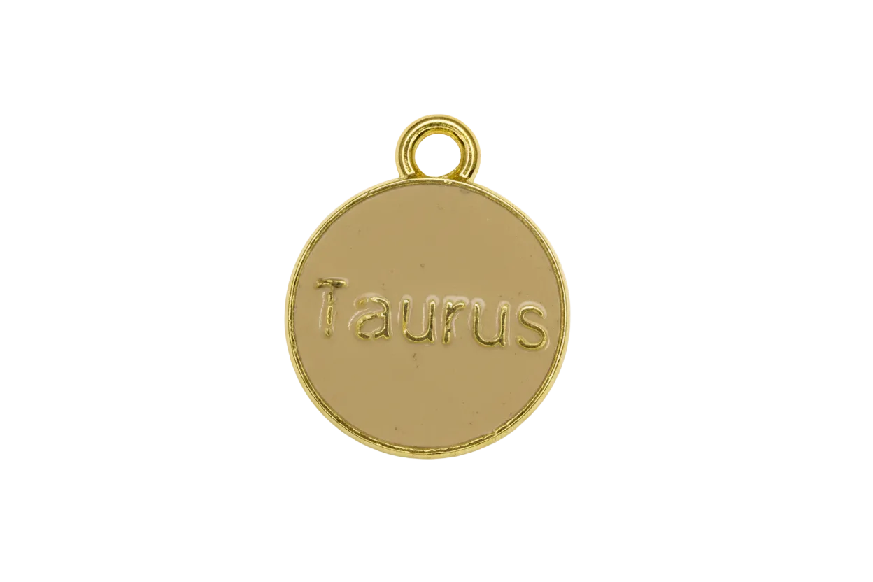 Round taupe enamel Taurus zodiac medallion with raised gold lettering and gold rim