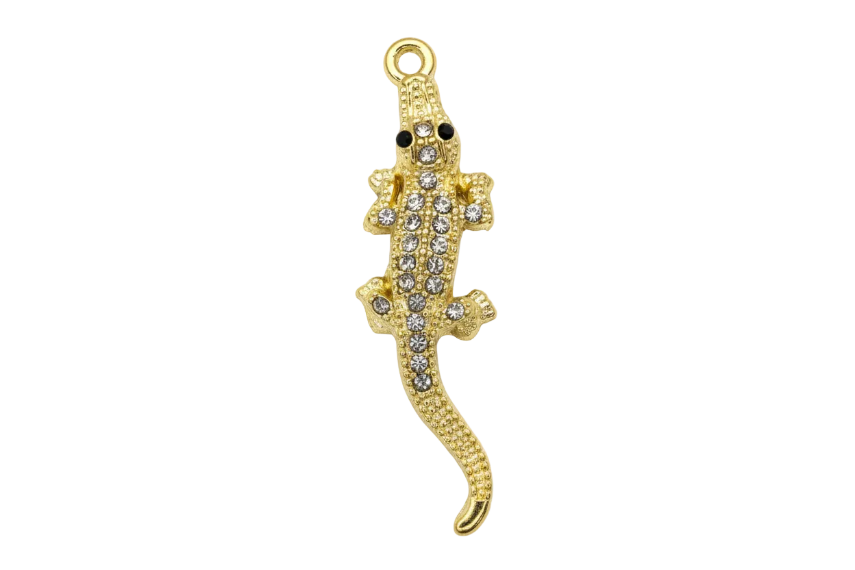 Gold gecko charm with clear crystal pavé and black eyes