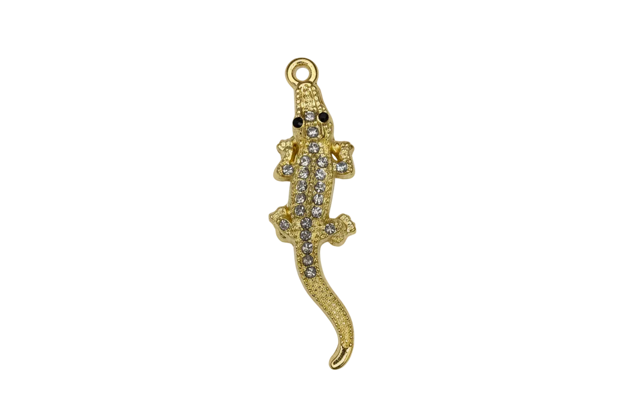 Gold gecko with clear crystal pavé and black eyes