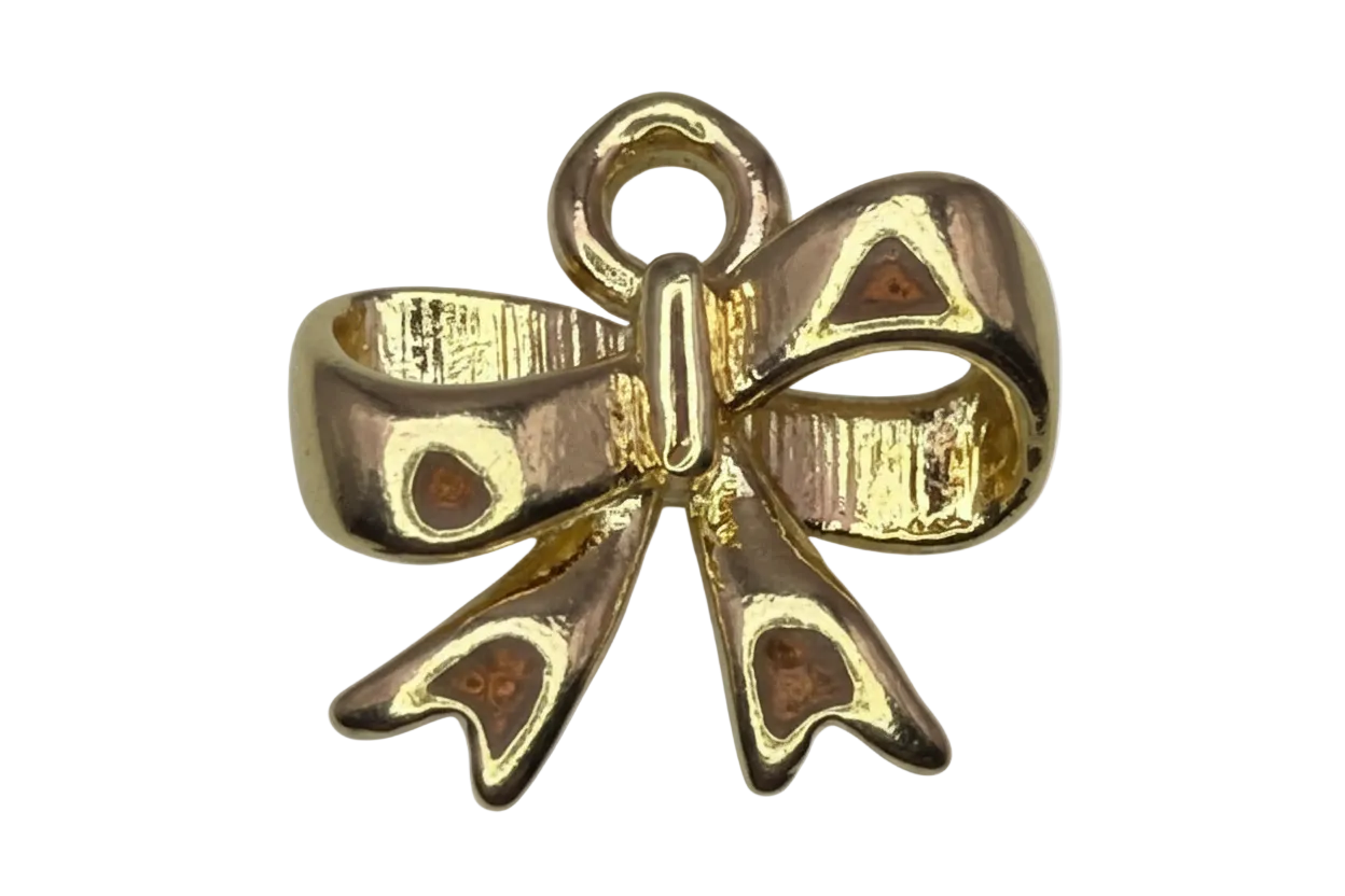 Gold ribbon bow with brown enamel and black spotted details, glossy finish