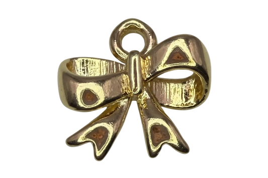 Gold ribbon bow with brown enamel and black spotted details, glossy finish