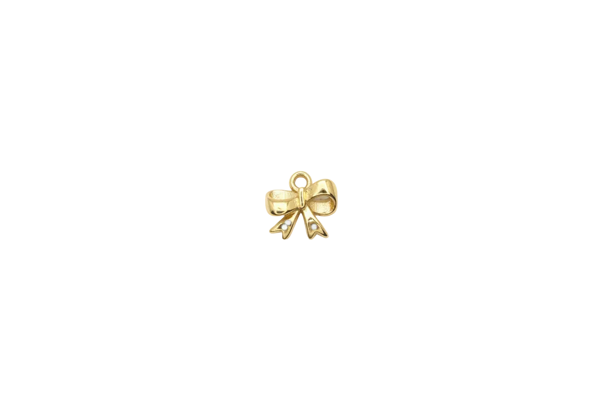 Gold ribbon bow with brown enamel and black spots