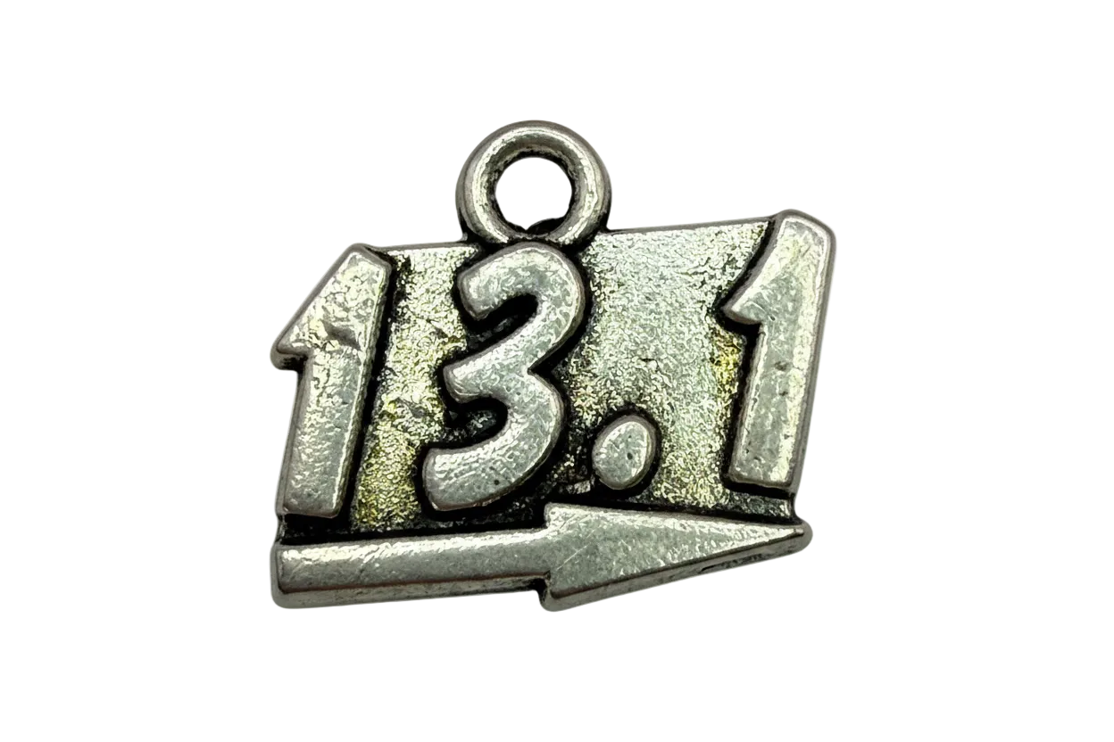 Antiqued silver 13.1 race distance plaque with raised numbers and arrow