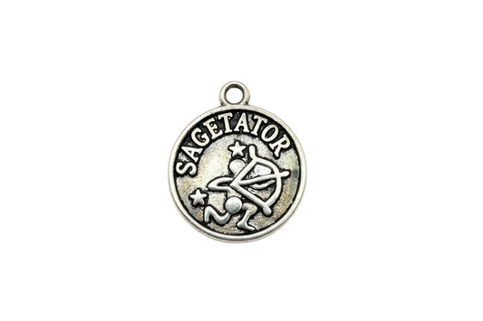 Round antiqued silver Sagittarius zodiac medallion with raised archer symbol, stars, and lettering
