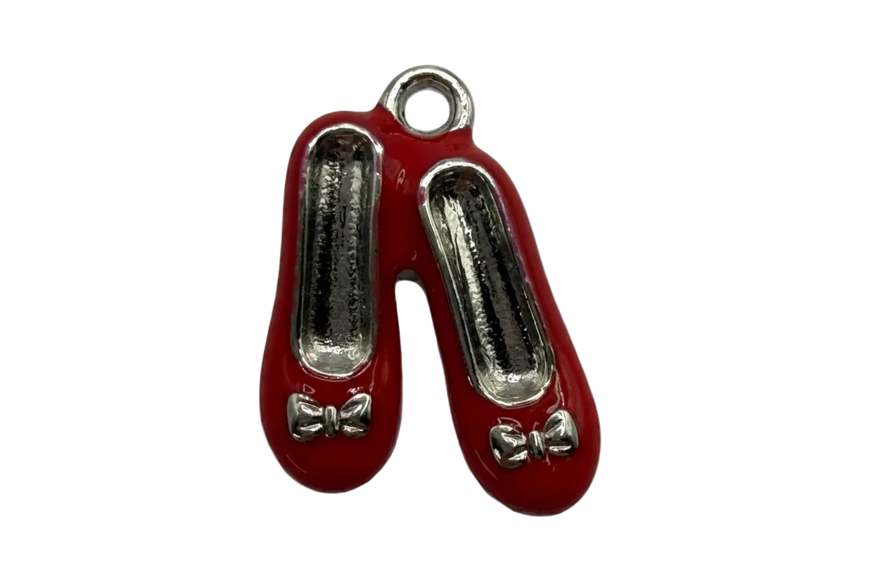 Glossy red ballet flats charm with silver-toned details and small bow accents