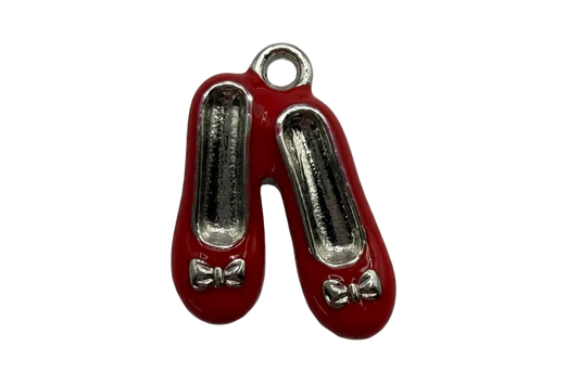 Glossy red ballet flats charm with silver-toned details and small bow accents
