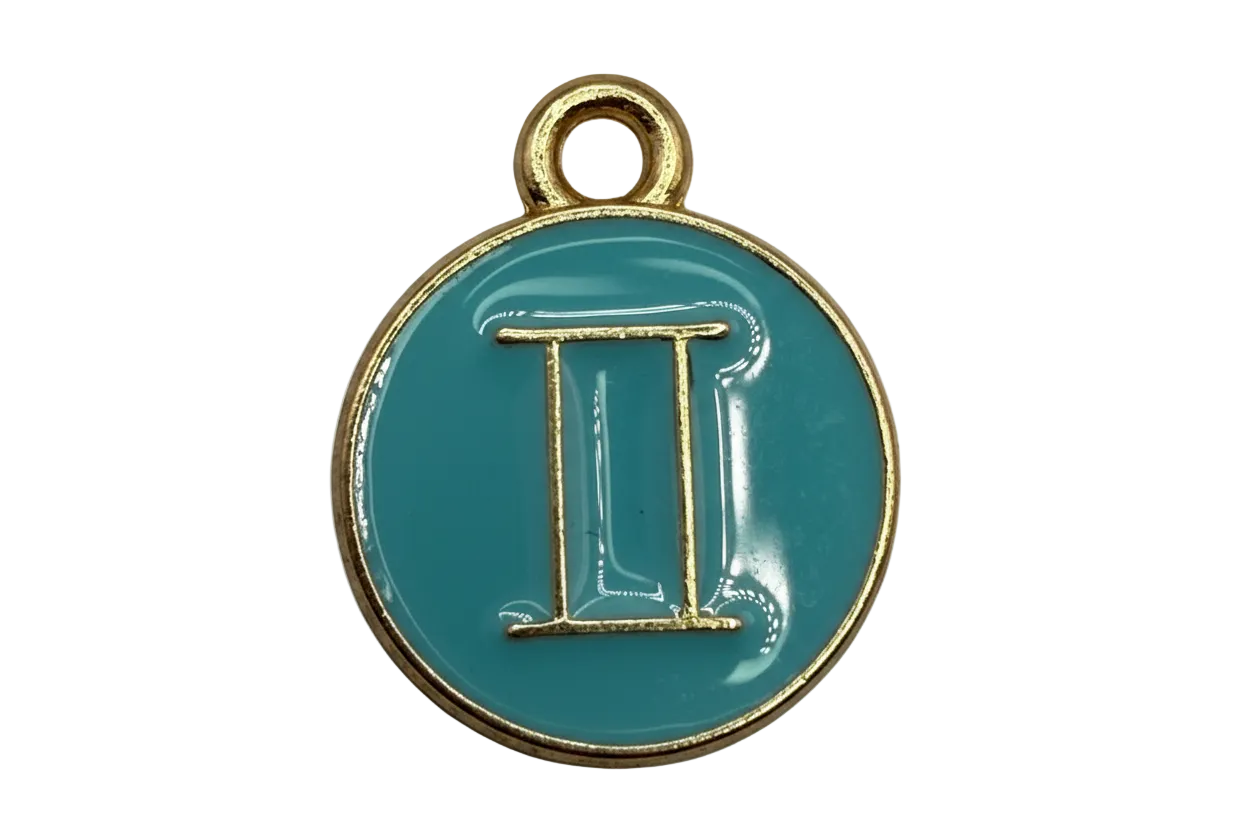 Glossy teal round coin with raised gold Gemini symbol
