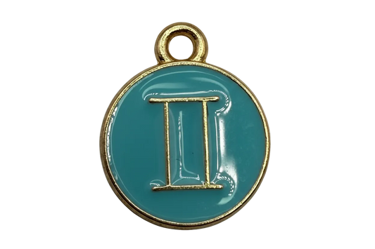 Glossy teal round coin with raised gold Gemini symbol