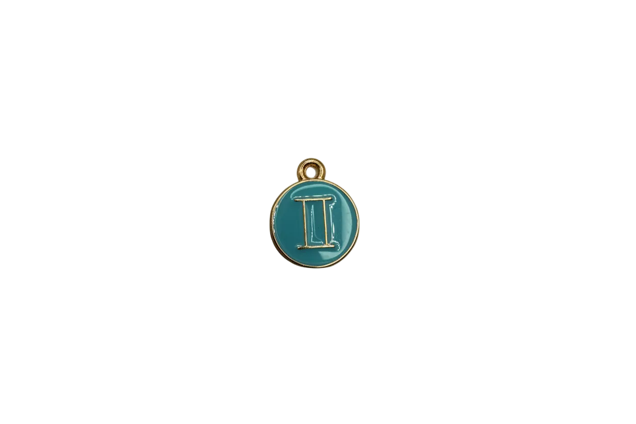 Teal coin with raised gold Gemini symbol