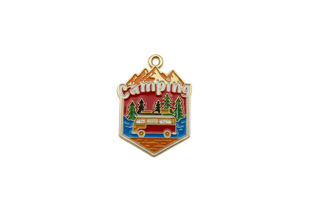 Enamel camping badge with mountains, trees, and retro camper van