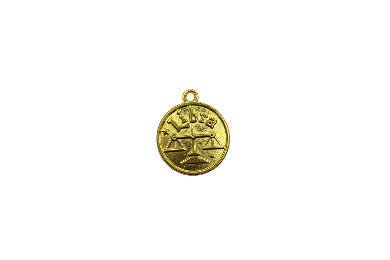 Gold Libra coin with embossed scales and lettering