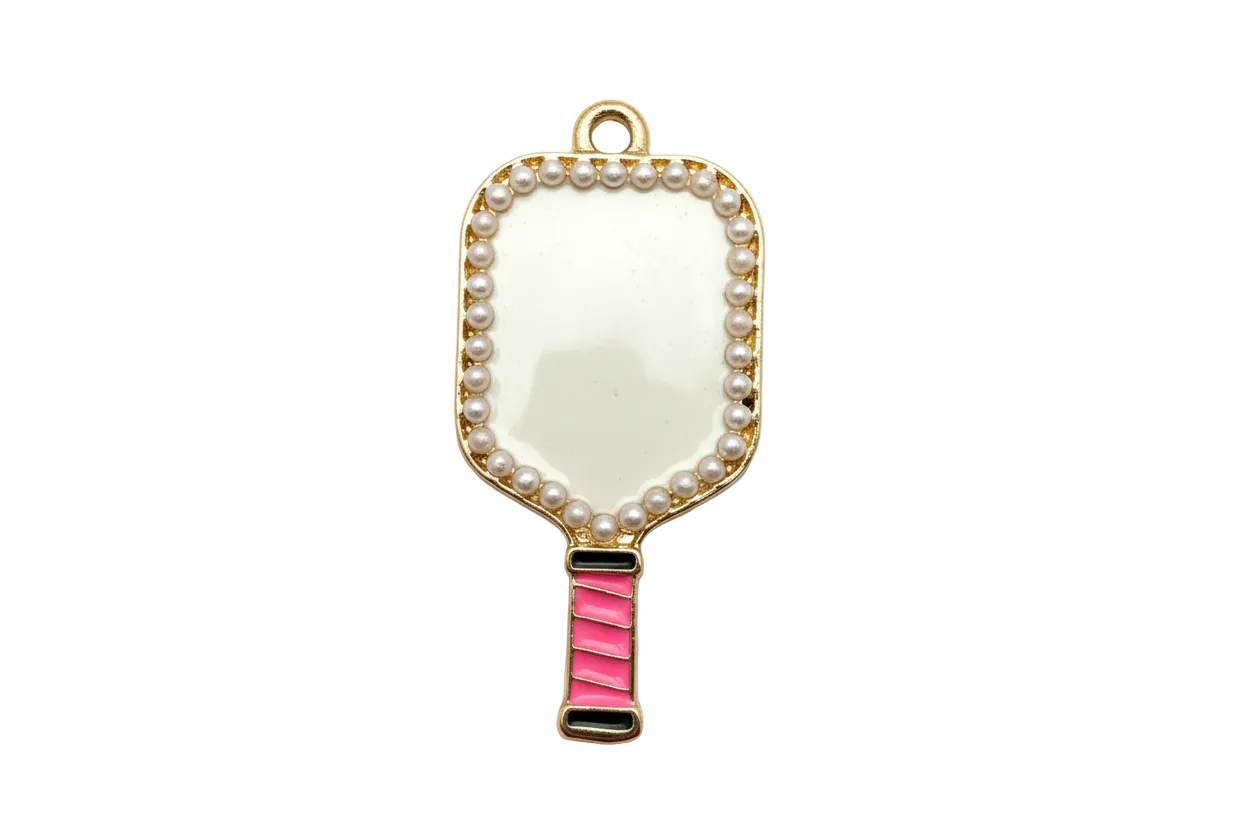 Gold hand mirror charm with pearl-like border, creamy white face, and bright pink handle
