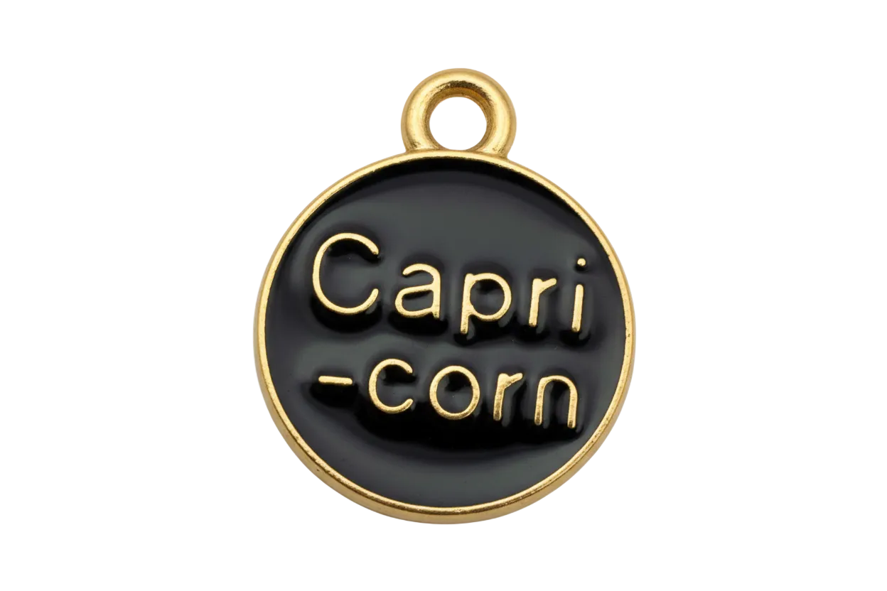 Black glossy round disc with raised gold Capri-corn lettering and gold rim