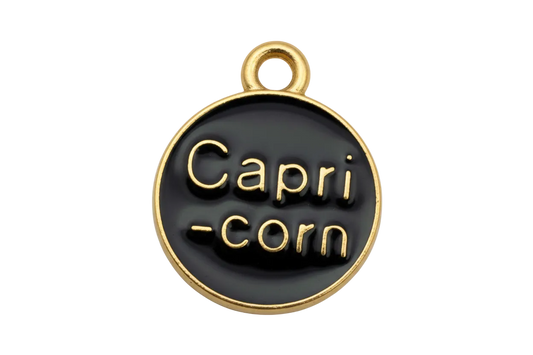 Black glossy round disc with raised gold Capri-corn lettering and gold rim