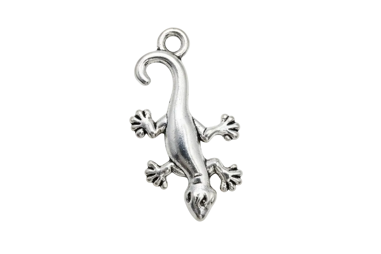 Polished silver gecko figure with curled tail and splayed toes on a black background