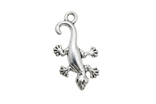Polished silver gecko figure with curled tail and splayed toes on a black background