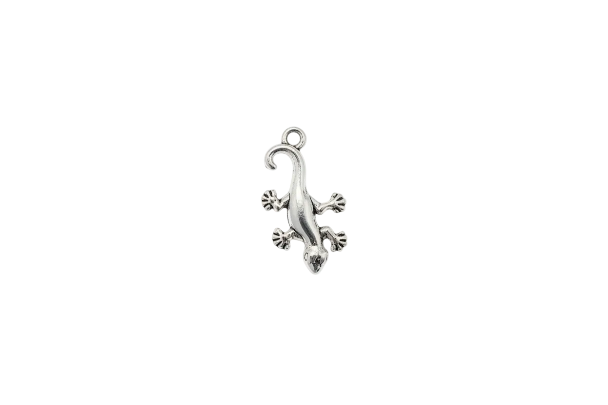 Polished silver gecko with curled tail and splayed toes