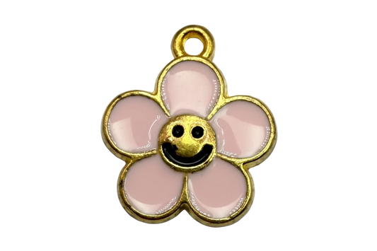 Gold-outlined blush pink enamel flower with a smiling face center
