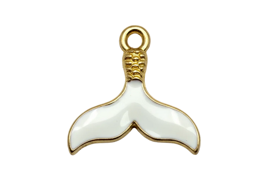 White enamel whale tail with gold outline and textured top detail on black background