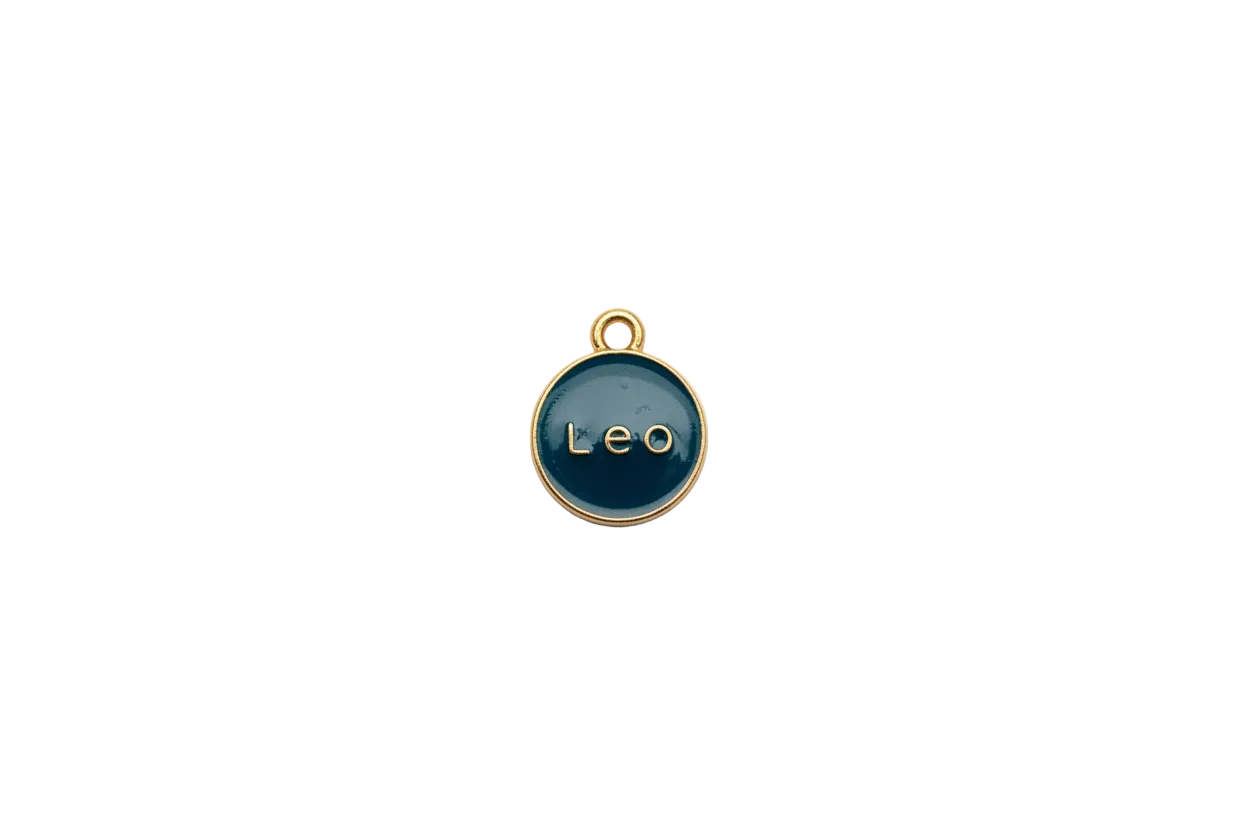Navy round medallion with raised gold “Leo” lettering