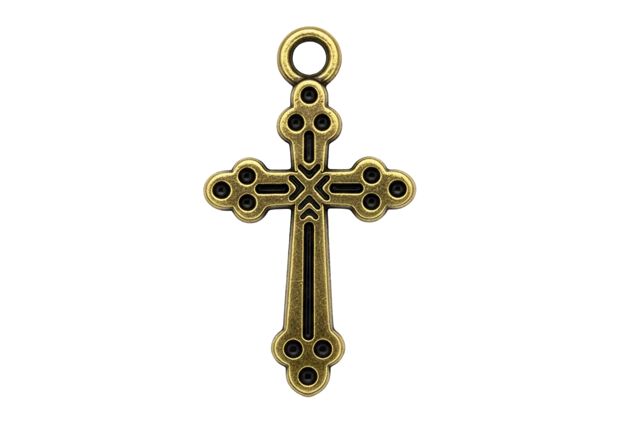 Ornate antiqued gold cross charm with cutout details and darkened recesses