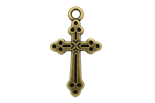 Ornate antiqued gold cross charm with cutout details and darkened recesses