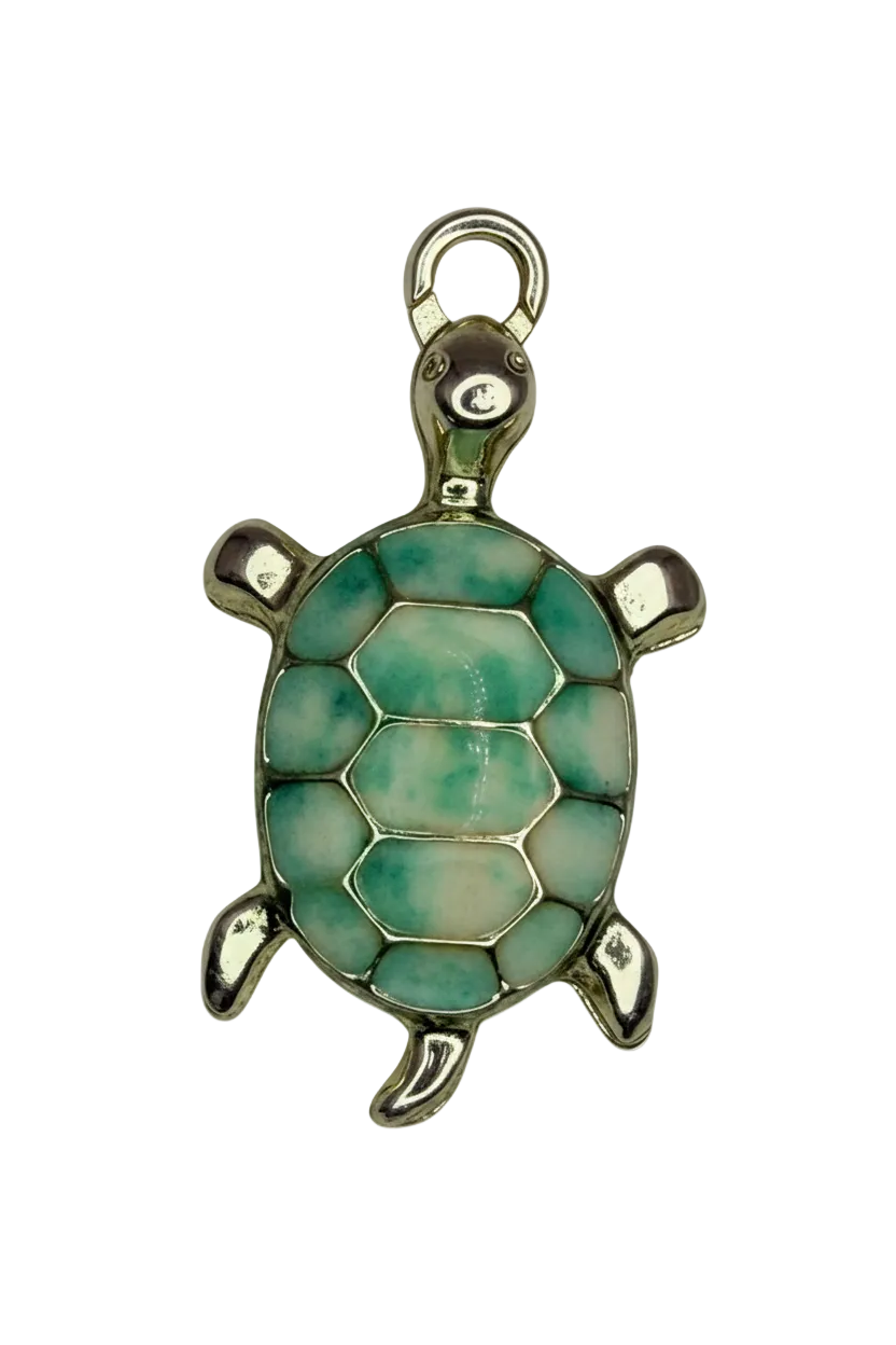 Gold turtle charm with seafoam and pale blue mosaic shell on black background