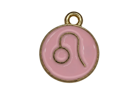 Round blush-pink enamel medallion with raised gold Leo zodiac symbol
