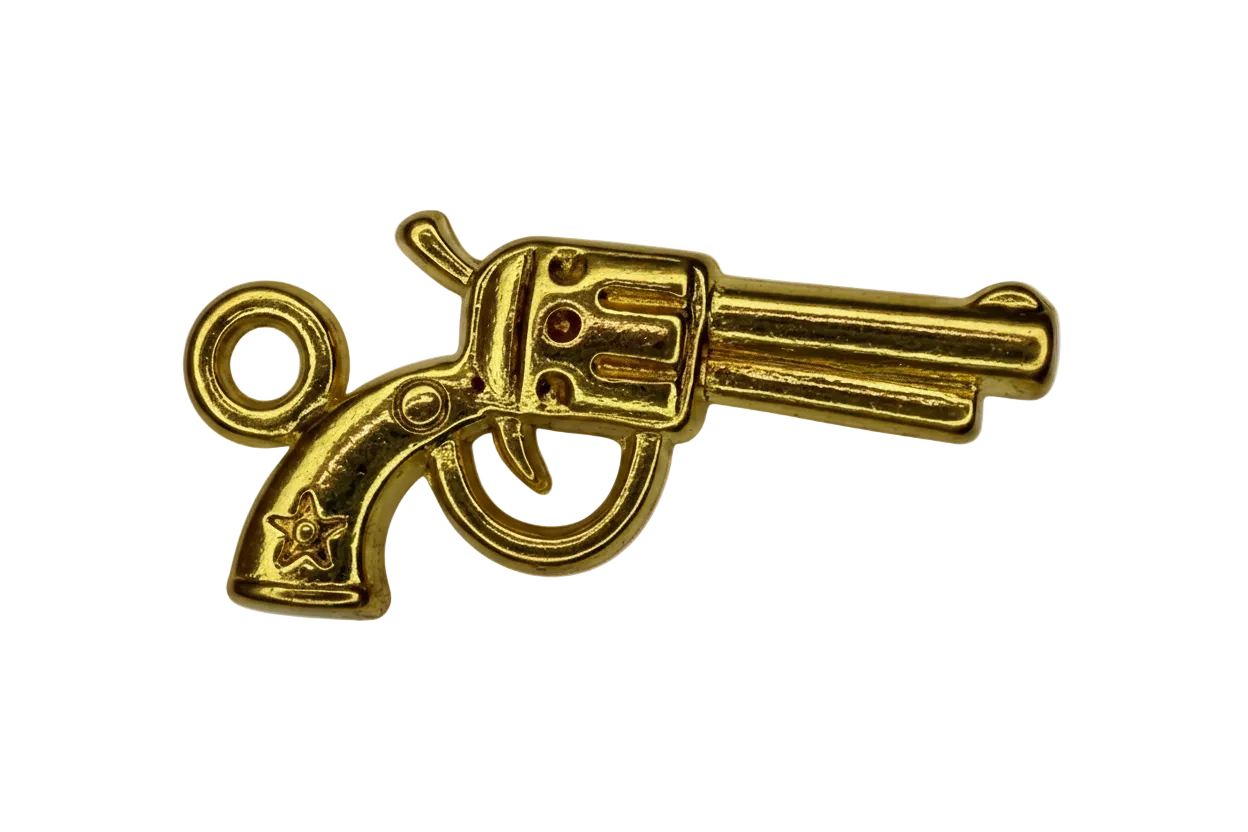 Polished gold revolver pistol charm with engraved details on black background