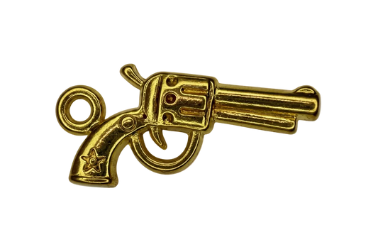 Polished gold revolver pistol charm with engraved details on black background