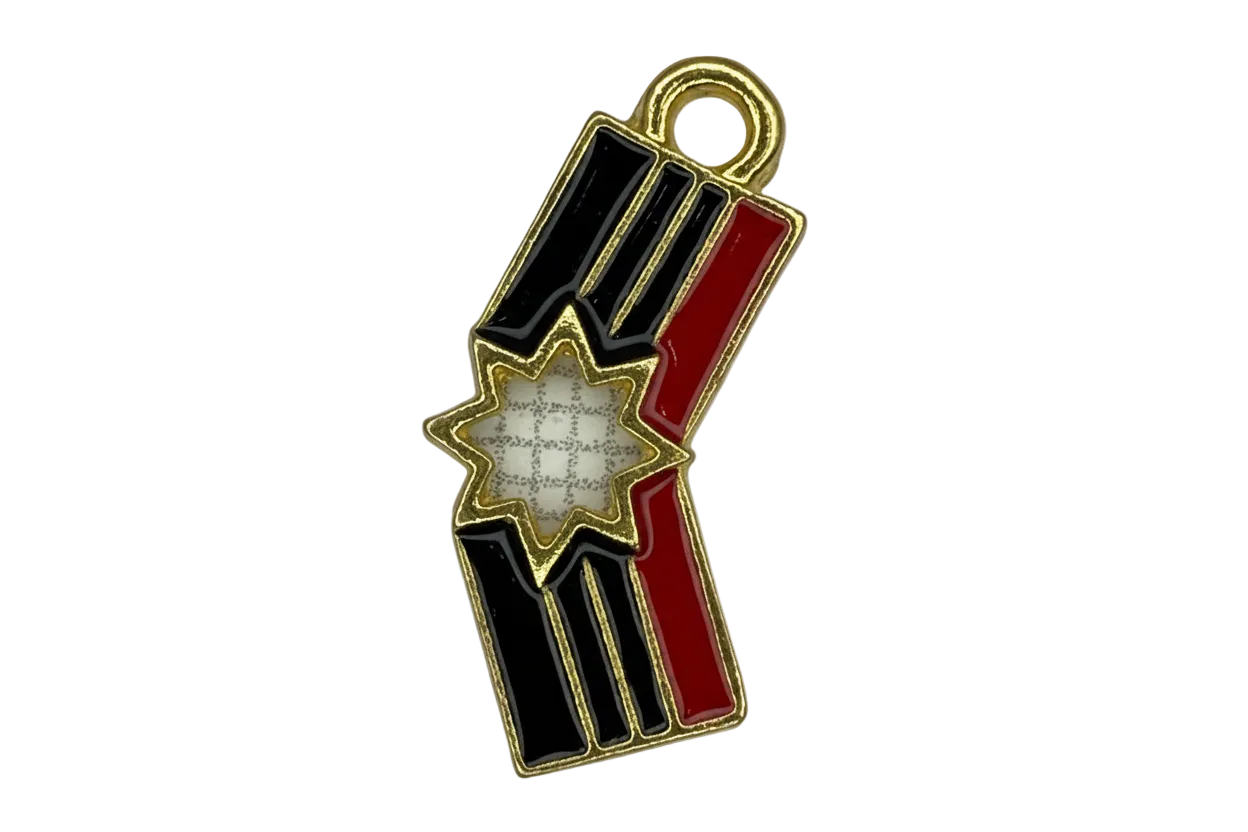 Gold-outlined firework stick charm with glossy black and red enamel and a white starburst center