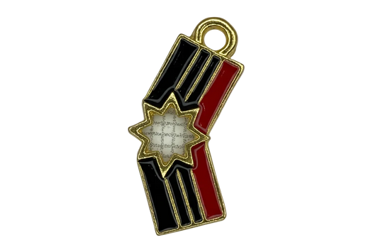 Gold-outlined firework stick charm with glossy black and red enamel and a white starburst center